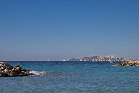sailing boat seen from the Prado beach in Marseilleの写真素材