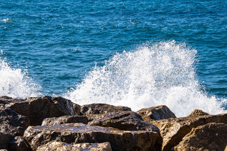 waves splashing at rocky shore of Mediterranean Sea, Prado beach, Marseille, Franceの写真素材