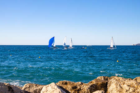 sailing boat seen from the Prado beach in Marseilleの写真素材