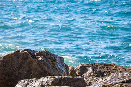 waves splashing at rocky shore of Mediterranean Sea, Prado beach, Marseille, Franceの写真素材