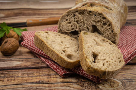 nut bread cut on a wooden background