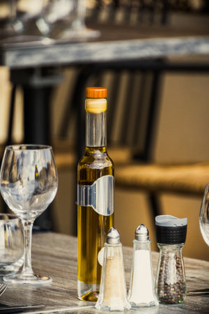 restaurant table set up with dishes outdoorsの写真素材