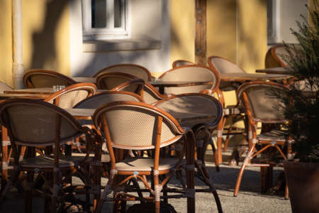 empty street cafe chairs and tables in Paris, Franceの写真素材