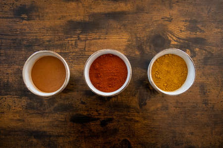 top view of spice dish on a wooden background