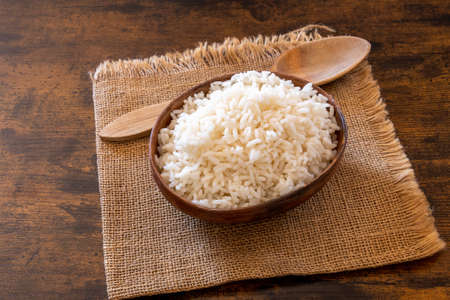 bowl of white rice on a burlapの写真素材