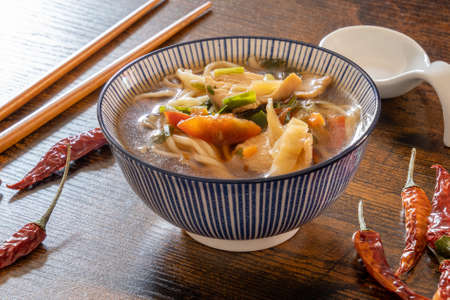thai style noodle soup with chicken and vegetables, healthy foodの写真素材