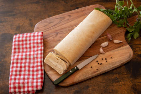 top view of a topped bread on a wooden boardの写真素材