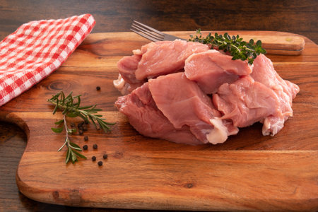 piece of raw veal on a wooden boardの写真素材