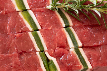 close up of raw beef skewer with rosemaryの写真素材