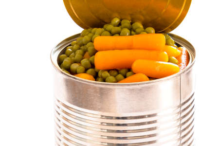 close up of carrot peas in a tin can isolated on a white backgroundの写真素材