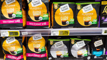 packets of black card brand coffee in a supermarket