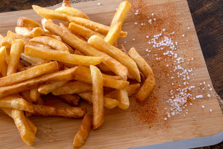 pile of fresh French fries with saltの写真素材
