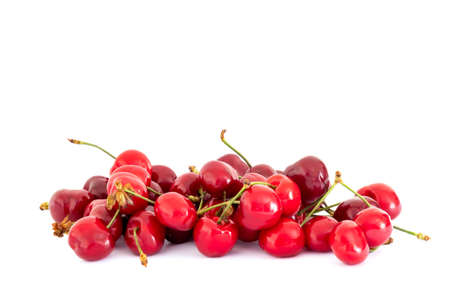 several red cherries isolated on a white backgroundの写真素材