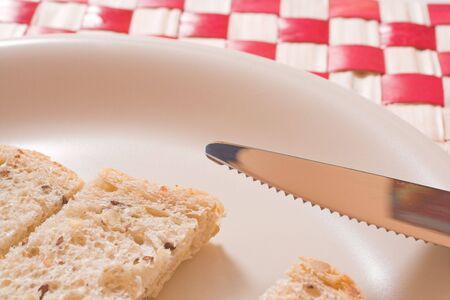 bread in plate over whiteの写真素材
