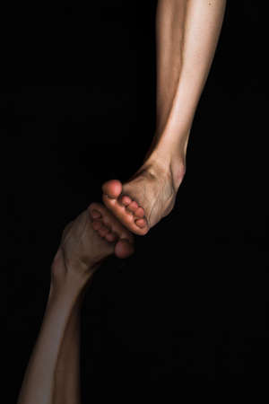 woman leg with reflection over black backgroundの写真素材