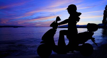 scooter over scenery sunset shot from english bay
