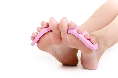 foot care shot with woman feet over white background