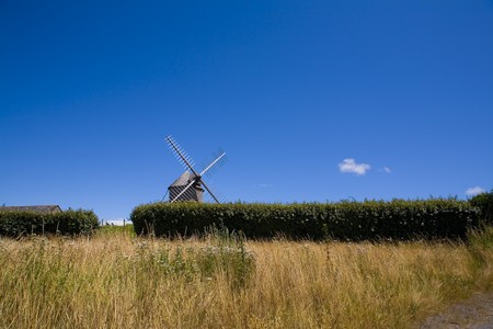 windmill in wide field in brittany in franceの写真素材