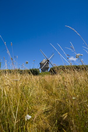 windmill in wide field in brittany in franceの写真素材