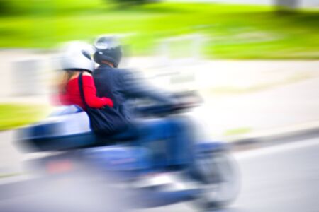 fast blurry pass by of a scooter in parisの写真素材