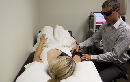 chiropractor with patient at a chiropractic clinicの写真素材