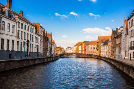 Colorful houses near the river in the city of bruges belgiumの写真素材