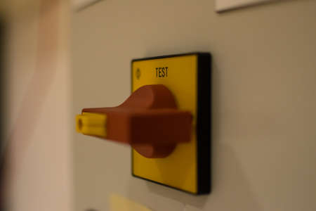 Switch testing systems.  A red and yellow switch used in different eletrical applications.の写真素材