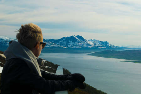 Beautiful girl at viewpoint lookingの写真素材