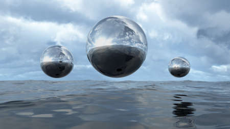 3D rendering abstract liquid transparent sphere above waterの写真素材