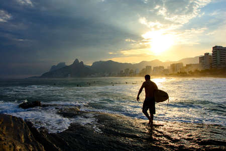Surf at sunset in Arpoador beach at Ipanema in Rio de Janeiroの写真素材