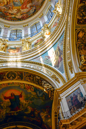 Interior of the old and famous St. Isaac's Cathedral with its frescoes, columns and paintings in St...