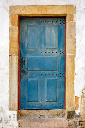 Old, aged and rustic blue wood door