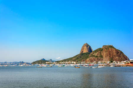 Botafogo Bay with their boats and the Sugar Loaf hill in Rio de Janeiroのeditorial素材
