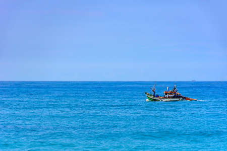 Fishing boat sailing in the waters of the Rio de Janeiro seaの写真素材