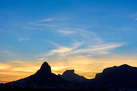 Image of the late afternoon at Lagoa Rodrigo de Freitas in Rio de Janeiro with its mountains, buildings and characteristic outlineの写真素材