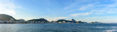 Copacabana Beach in Rio de Janeiro with its buildings, sea, sand and the Sugar Loaf hill in the backgroundの写真素材