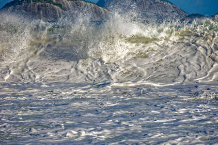 Wave crashing at Ipanema beach in Rio de Janeiro