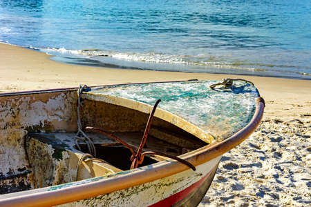 Old fishing boat on the sand of Copacabana beach in Rio de Janeiroの写真素材