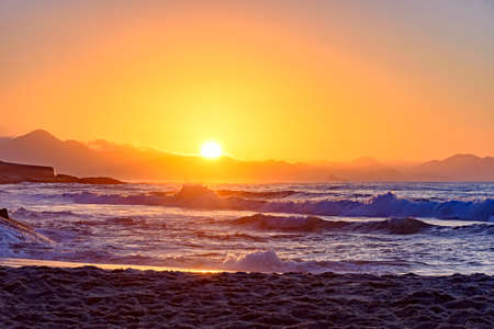Tropical sunrise at Devil beach with Copacabana Fort in the background at Rio de Janeiroの写真素材