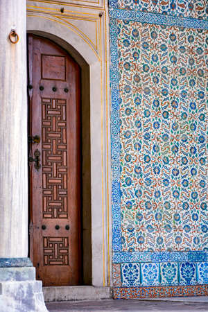 Old and historic Ottoman wooden door in Instambul with frescoes and columnのeditorial素材