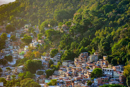 Favela between the vegetation of the slopes of the hills in Copacabana in Rio de Janeiroの写真素材