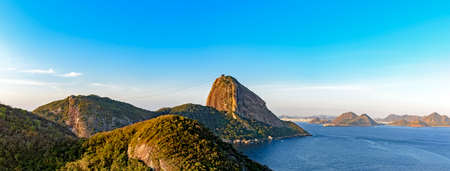Top view of the Sugar Loaf hill, Guanabara bay, sea and hills and mountains of Rio de Janeiro with the city of Niteroi in the backgroundの写真素材