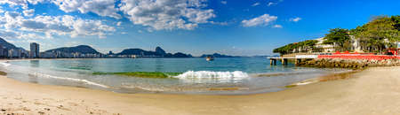Panoramic shot of Copacabana beach with sean hills and buildings at Rio de Janeiro, Brazil in a summer day at morningのeditorial素材