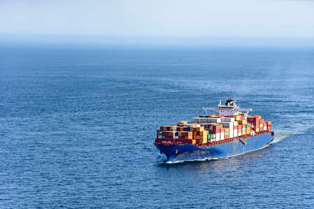 Cargo ship carrying several containers on the waters of the sea of rio de Janeiro, Brazil