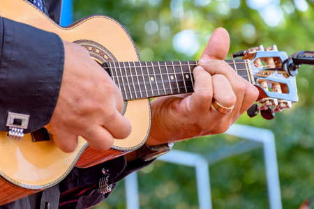 Live musical performance of Brazilian popular music called chorinho with little acoustic guitar with...