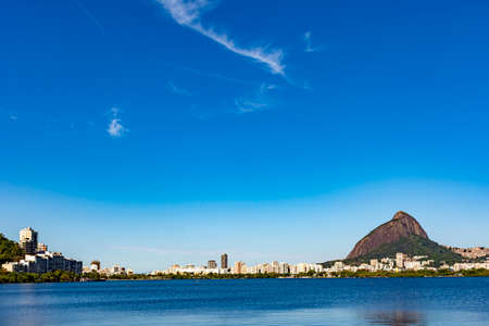 Rodrigo de Freitas lagoon with the buildings of Ipanema and Leblon on city of Rio de Janeiro, Two Brothers hill and Gavea stoneの写真素材