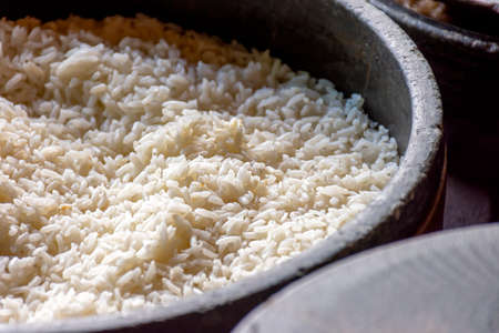 Freshly prepared white rice ready to serve in a traditional clay pot used in the interior of Brazilの写真素材