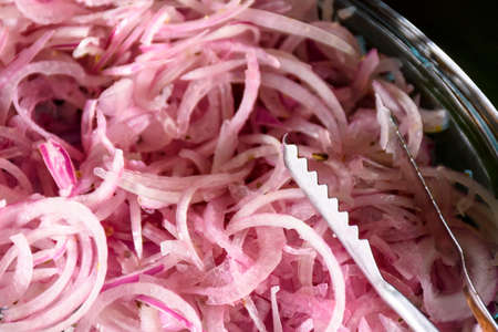 Sliced fresh purple onions salad ready to be eaten and eatenの写真素材