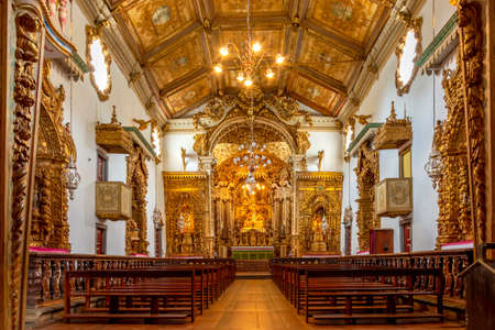 Interior of historic 18th century church in gold-plated baroque style in the ancient city of...