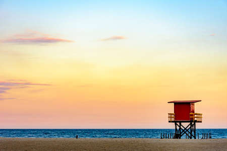 Rescue cabin on Copacabana beach at a tropical sunset on Rio de Janeiro city, Brazilの写真素材